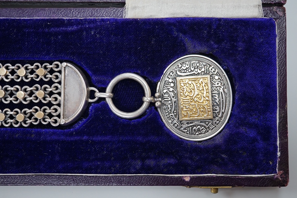 A cased Middle Eastern medallion